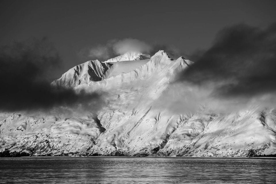 Aialik Bay, Alaska. Sunrise on peaks in Aialik Bay during a winter sailing and backcountry skiing trip in Kenai Fjords National Park.