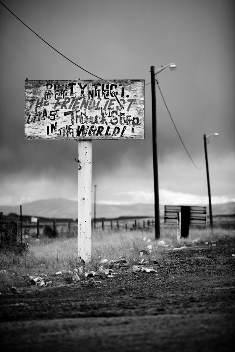 Friendliest Truck Stop, Nevada. A deserted sign in Nevada that has since been taken down. Fujicolor Crystal Archive print, black and white.