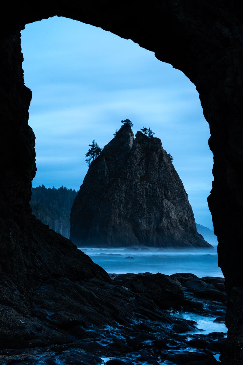 Hole in the Wall at Dusk, Olympic National Park. Looking through Hole in the Wall after sunset on the north end of Rialto Beach, Olympic National Park, Washington.