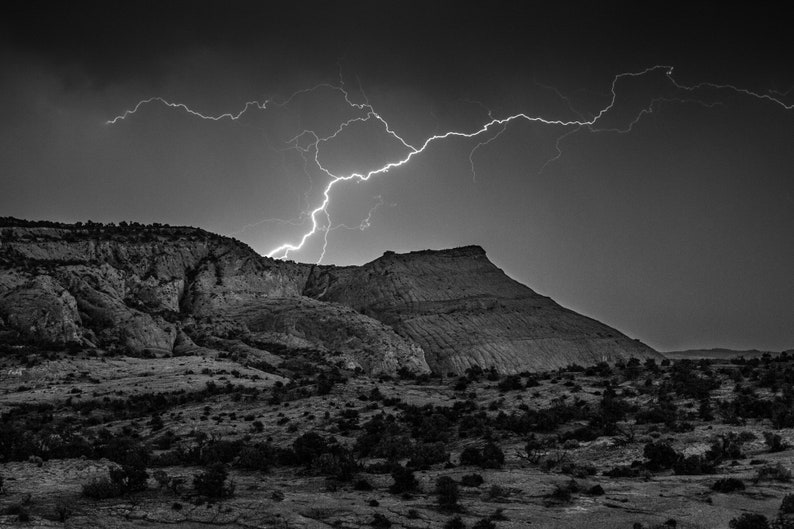 Lightning in the Desert, Utah. A lightning strike over desert cliffs.