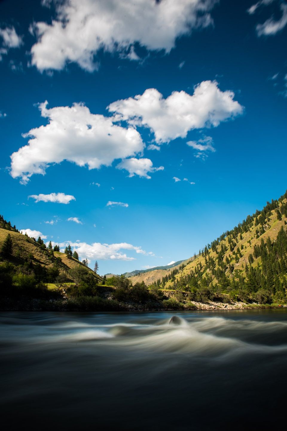 Salmon River, Idaho. Clouds hang high and still as the Salmon River flows down canyon.