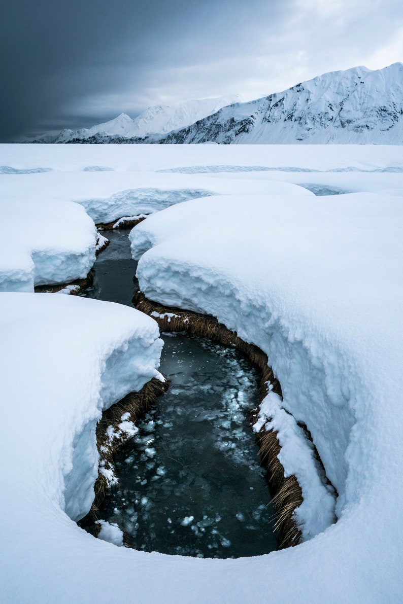 Snowy Creek in a Spring Storm, Kenai Fjords, Alaska. Snowmelt finds its way to the ocean at the north end of Aialik Bay as a storm passes over the Harris Peninsula.